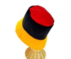 This Rasta Jamaican Bucket hat is perfect for Summer Reggae Festivals. This solid Bucket hat features a Jamaican Rasta Inspired Striped Band atop a solid , Red green yellow Rasta color bucket hat. Rock this hat as you dance the night away at your next outdoor concert or event. Fashionable and a must-have . This Hat is unisex that looks great on both men and women . This Hat is very durable and can be used as a special gift . -Solid Unisex Jamaican Adult Sun Hat -Rasta Reggae Inspired Striped Ban Red Mini Cap For Beach, Red Bucket Hat For Festivals, Red Cap-shaped Sun Hat, Adjustable Red Bucket Hat, Red Wide Brim Bucket Hat For Festival, Vintage Red Bucket Hat, Red Adjustable Sun Hat For Festivals, Red Sun Hat With Short Brim For Festival, Adjustable Red Sun Hat For Festivals