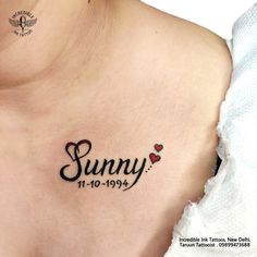 a woman's chest with the word sunny tattooed on it and hearts in black ink