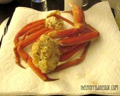 crab legs on a white towel sitting on a table