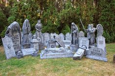 a cemetery with many headstones and statues