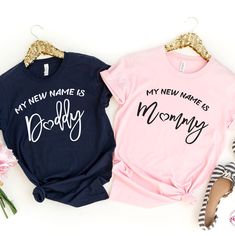 two shirts that say my new name is daddy and mommy