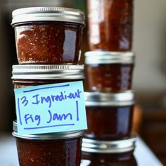 three jars filled with jam sitting on top of a table next to a sign that says 3 ingredient fyj jam