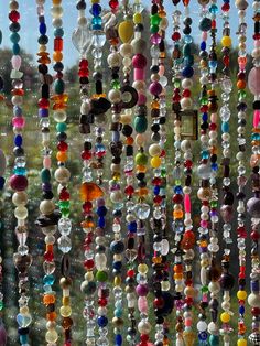 beads hanging from the side of a window