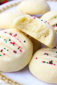 some cookies with sprinkles on a plate