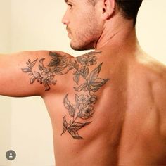 a man with a flower tattoo on his back