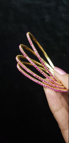 "* Handcrafted Gold Plated CZ Bangle Set * High Quality 22 K Gold Plated 4 pc bangle set; * 2.4 inches= ( 2.25\" diameter of the inner circle) ; 2.6 inches = ( 2.40\" diameter of the inner circle); 2.8inches = (2.54\" diameter of the inner circle) * Sold as a set of 4 bangles Gorgeous gold-plated bangle/ bracelet best exemplifies the careful craftsmanship done on it -- a specialty at Nemali Jewelry. It has special tone of elegance attached to it. The intricate handmade design of the bangle / bra Pink Hand Set Bracelets For Festivals, Pink Bangle Jewelry For Diwali, Temple Jewelry Style Round Bangle For Party, Temple Jewelry Style Bangle For Party, Temple Jewelry Bangle For Party, Pink Hand Set Bangle As A Gift, Pink Stackable Jewelry For Festive Occasions, Festive Pink Stackable Jewelry, Pink Stone Work Bangle For Wedding