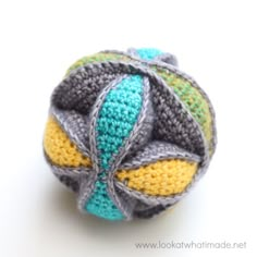 a crocheted ball sitting on top of a white table