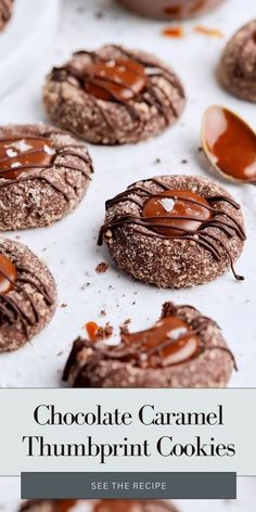 chocolate caramel thumbprint cookies on a baking sheet