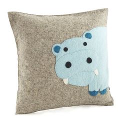 a pillow with a hippo design on it