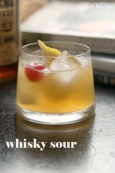 a close up of a drink in a glass on a table