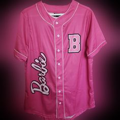 a pink baseball jersey with the letter b on it's chest and letters across the chest