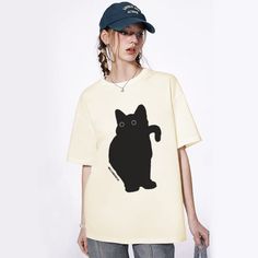 Look cool and show off your unique style with the Apathy Little Black Cat T-shirt. This comfortable garment is made of 100% organic cotton, with a bold and eye-catching design. With a relaxed fit, it's perfect for everyday use. Stand out from the crowd by pairing this t-shirt with your favorite jeans. Features: -100% Cotton -Crew Neckline -Dropped Shoulder -Cat Graphic -Regular fit -Unisex style Relaxed Fit Short Sleeve T-shirt With Cat Design, Relaxed Fit Cat Print T-shirt With Crew Neck, Cat Design Short Sleeve T-shirt For Streetwear, Relaxed Fit Short Sleeve T-shirt With Cat Print, Cat Print Crew Neck T-shirt For Streetwear, Relaxed Fit Cat Design Tops For Streetwear, Relaxed Fit Tops With Cat Design For Streetwear, Oversized Cotton Tops With Cat Print, Trendy Cat Design T-shirt For Streetwear