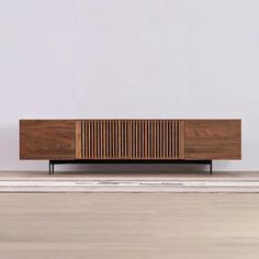 the sideboard is made out of wood and has an interesting pattern on it's sides