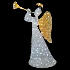 an angel with a trumpet in its hand and lights on it's body, against a black background