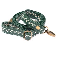 "2,0 cm (3/4 inch) Thin Vegan Crossbody Purse Strap, Extra Long Adjust Embroidered Strap for Bags and Purses, Dark Green Messenger Bag Strap ◾️ Strap color: Dark Green ◾️ Pattern: Light Beige Pine Cones Replacement vegan leather purse strap made of soft, premium quality vegan leather. It feels like natural leather to the touch. It's very comfortable to wear. It's good for small and medium size bags and purses. This pattern match perfectly for boho style purses and hippie bags. The strap is adjustable, you can carry your bag on shoulder or cross the body. This adjustable crossbody strap is very long, it is comfortable also for tall people. ▪️ Strap width: 2 cm (3/4\") ▪️ Strap maximum lenght: about 140 cm (55\") including carabiniers ▪️ Material: Vegan Leather I make this strap for you in o Green Messenger Bag, Boho Style Purses, Leather Purse Strap, Hand Painted Purses, Embroidered Handbag, Green Purse, Bags And Purses, Hippie Bags, Quilted Crossbody Bag