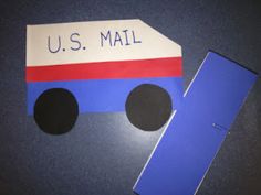 a mailbox shaped like a truck with the word u s mail painted on it