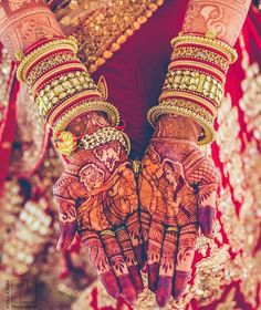 the hands are decorated with gold and jewels