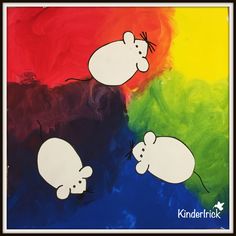 two white mouses on a multicolored background