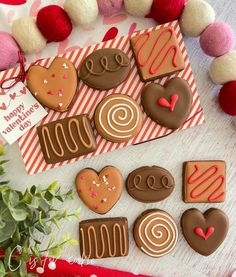 some decorated cookies are sitting on a table