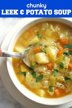 a white bowl filled with soup and vegetables