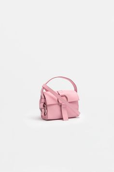 Our ULTRA MINI BAG in light pink is probably one of the cutest bags we made so far. 
Just like it’s bigger sister, it’s the perfect companion and draws attention wherever you go. The matching cross body strap that comes with the bag makes it the perfect everyday handbag. Everyday Handbag, Big Sister, Cute Bag, You Bag, Bag Making, Mini Bag, Calf Leather, Cross Body, Light Pink