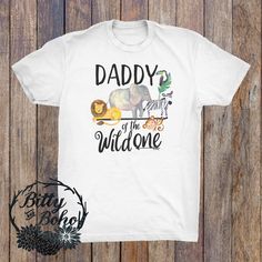 "Zoo Theme Dad Shirt (White Unisex Shirt - Fitted Style, may need to size up for Men) This shirt is perfect for the dad of the birthday boy/girl or just to wear any day with \"Daddy of the Wild One\" and cute watercolor style zoo animals including an elephant, zebra, lion and monkey hanging from an arrow. Design is printed directly into the fabric using commercial quality and kid safe inks to a super soft white Unisex t-shirt. Great for photos with dad, mom and the Birthday Boy/Girl, family phot The Wild One, Boho Birds, Birthday Boy Shirt, Zoo Birthday, Matching Family Shirts, Funny Tank Tops, Birthday Boy Shirts, Boy Shirt, Wild One