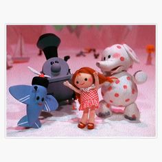 there are many toy animals standing together in front of a pink background with white polka dots