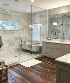 a bathroom with wooden floors and white fixtures