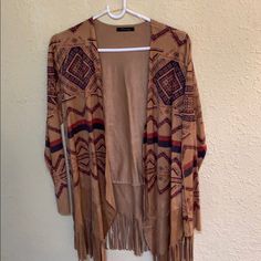 This Cardigan Is One Of A Kind! -One Size - Suede Material - Bohemian/Country Style -Fringe At The End -Never Worn -Khaki Color With Pattern Bohemian Beige Outerwear With Tassels, Brown Bohemian Open Front Cardigan, Bohemian Long Sleeve Cardigan With Fringe, Bohemian Brown Outerwear With Tassels, Bohemian Fringe Cardigan For Festivals, Fringe Long Sleeve Cardigan For Festivals, Suede Material, Khaki Color, Country Style