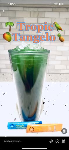 a green drink sitting on top of a table