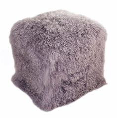 a grey furry stool on a white background