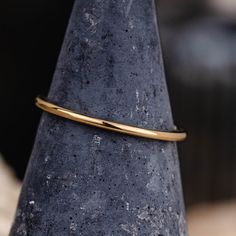 Introducing The Meridian - a stunningly simple and delicate 1mm yellow gold stacking ring that draws inspiration from Earth's meridian - a circle of constant longitude that symbolizes balance and structure in our universe. The Meridian is perfect for the woman who appreciates minimalist design and values understated elegance. Handcrafted from 100% recycled gold, this essential yellow gold stacking band provides the perfect balance to any standalone look or collection, making it an ideal choice f Minimalist Handmade Yellow Gold Stackable Rings, Classic Hammered Yellow Gold Stackable Rings, Classic 14k Gold Stackable Hammered Rings, Minimalist Hammered 14k Gold Stackable Rings, Yellow Gold Stacking Rings, Recycled Gold Ring, Simple 14k Gold-filled Yellow Stackable Rings, 10k Gold Ring, Gold Rings Stackable