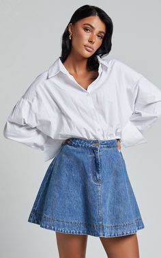 The Koemi Skirt is the perfect addition to your denim collection. Made from recycled cotton, this high-waisted skirt features a flattering fit and flare silhouette that will accentuate your curves in all the right places. The mid blue wash adds a casual yet trendy vibe, making it easy to style with any top or sweater. Whether you're heading out for brunch with friends or hitting up a summer festival, this mini denim skirt is a must-have for every fashion-forward girl's wardrobe. Product Details: Cotton Material Fabrics, Skirt Ootd, Flared Denim Skirt, Mini Denim Skirt, Denim Collection, Girls Wardrobe, Denim Flares, Summer Festival, High Waisted Denim