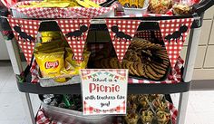 a shopping cart filled with snacks and condiments