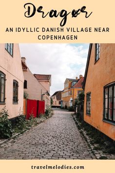 a cobblestone street with text overlay that reads, the best things to do in prague an idyllic danish village near copenhagen