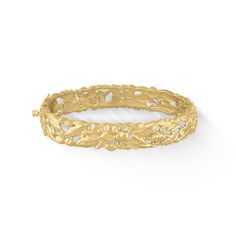 14K Yellow Gold Flowers of the Islands Hinged Bangle Bracelet with a 0.05 Carat Diamond. The bangle measures approximately 12mm in width. The inner circumference of the bangle measures approximately 7".Please note that the clasp tongue is manufactured in 14K White Gold. Luxury Yellow Gold Ornate Bangle, Ornate Yellow Gold Filigree Bangle, Luxury Gold Ornate Bangle, Victorian Yellow Gold Bangle Bracelet, Hawaiian Bangles Gold, Gold-plated Yellow Bangle With Intricate Design, Hinged Bangle, Gold Flowers, Bangle Bracelet