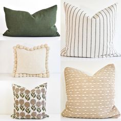 four pillows with different patterns on them and one has a pom - pom