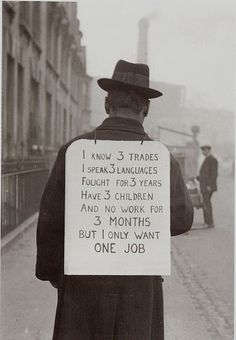 a man holding a sign that says i know 3 trade speaks languages four years have 3 children and no work for 3 months but i only want one job