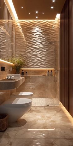 a modern bathroom with two sinks and a large mirror above the sink is illuminated by recessed lights