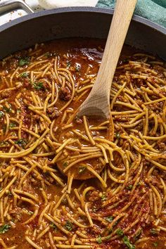 a large pot filled with spaghetti and sauce