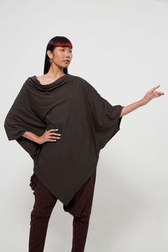 "🚚..ALL ORDERS ARE SHIPPED VIA DHL EXPRESS MAIL Easy to wear, yet unique in style. A charming asymmetric tunic top that flaunts a sweet, contemporary style. Simple design with a cowl neckline, dropped shoulders. ¾ batwing sleeves and asymmetrical hemline. DETAILS: ▪ Pull-on style ▪ Cowl neck ▪ ¾ batwing sleeves ▪  Dropped shoulders ▪ Asymmetric hem ▪ Loose silhouette MEASUREMENTS: Sleeve length: 15\" (38 cm) Sleeve cuff: 15\" (38 cm)-round Bust: 67\" (170 cm) Hips: 44\" (112 cm) Tunic top lengt Fitted Asymmetrical Lagenlook Top, Asymmetrical Lagenlook Top In Solid Color, Lagenlook Solid Top With Asymmetrical Hem, Lagenlook Solid Color Top With Asymmetrical Hem, Asymmetrical Cotton Tops For Fall, Black Tops With Relaxed Fit And Asymmetrical Hem, Black Tops With Asymmetrical Hem And Relaxed Fit, Lagenlook Tops With Stretch And Asymmetrical Hem, Lagenlook Top With Stretch And Asymmetrical Hem