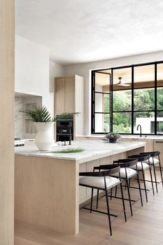 the kitchen is clean and ready to be used for cooking or dining, as well as seating