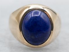 Show off your personality with this beautiful yellow gold bezel set oval cut lapis solitaire ring! The perfect combination of sparkle and sophistication, you'll love the unique shape and deep blue color of this statement piece! Wear it day or night for some extra wow-factor!Metal: 10K Yellow GoldGem: Lapis 2.59 CaratsGem Measurements: 8.5 x 10.2 mm, OvalRing Size: 4.25Marks: "10K" Stamped on the inside band Luxury Oval Lapis Lazuli Rings, Oval Lapis Lazuli Ring For Anniversary, Luxury Lapis Lazuli Oval Rings, Modern Blue Oval Signet Ring, Oval Lapis Lazuli Rings For Formal Occasions, Formal Lapis Lazuli Oval Rings, Lapis Ring, Oval Ring, Oval Rings