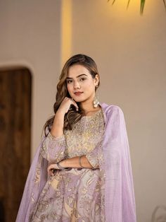 This 3-piece set includes purple cotton floral print & embroidered a line kurta, regular shape kurta has round neck, 3/4th sleeves, flared hem, above knee length teamed with cotton dhoti pants has elasticated waistband & slip on closure and a voile dupatta. The model wearing the size small is 5'8 in height. 3 Piece Set Color-Purple Kurta Fabric- Cotton Bottom Fabric - Cotton Dupatta Fabric-Voile Work - Floral Print & Embroidery detailing Neck - Round Neck Sleeves - 3/4th Sleeves Length-Above Kne Designer Embroidered Purple Salwar Kameez, Purple Floral Embroidery Sets For Eid, Purple Chikankari Embroidery Sets For Festive Occasions, Purple Straight Kurta With Dabka Details, Embroidered Purple Unstitched Suit For Diwali, Purple Chikankari Embroidery Festive Sets, Semi-stitched Mulmul Sets For Eid, Festive Purple Chikankari Embroidery Sets, Purple Dabka Kurta For Festivals