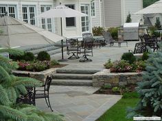 an outdoor patio with chairs and umbrellas