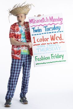 a young man holding a sign that says mismatch monday twin tuesday i color wed thursday fashion friday