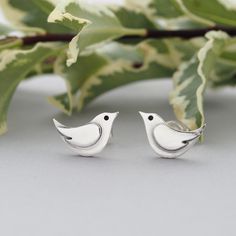 POSTAL DELAYS ARE COMMON DURING DECEMBER AND SADLY I CAN NOT GUARANTEE YOUR ORDER WILL ARRIVE IN TIME FOR CHRISTMAS.    These super cute dainty sterling silver bird stud earrings have been designed and handmade completely from scratch and entirely by hand using traditional silversmithing techniques in my Sussex (UK) workshop.   These little birds and their wing decoration are hand pierced (sawn out) from sterling silver sheet using a fine jewellers saw.   All components are then silver soldered together.   They have been subtly oxidised to enhance features of their design.  These little bird stud earrings measure approx. 13mm wide by 8mm high and are attached to sterling silver earposts.  Many thanks for visiting.   A beautiful matching necklace is also available here:   https://etsy.me/30 Wing Decoration, Hand Piercing, Stud Earrings Unique, Silver Bird, Bird Earrings, Bird Jewelry, Earrings Unique, Jewellery Gift, Little Birds