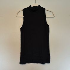 Brand New Gap Nock Neck Tank. Size Small, Black Spring Black High Neck Tank Top, Black High Neck Tank Top For Spring, Casual Black High Neck Tank Top, Casual High Neck Black Tank Top, Black High Neck Casual Tank Top, Gap Black Summer Top, Black Gap Top For Summer, Trendy Black Tops From Gap, Black Turtleneck Tank Top For Spring