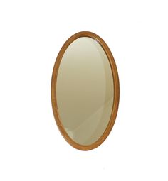 an oval mirror is shown against a white background and has wood trim around the edges