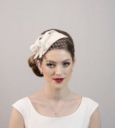 White colour fascinator hat from felt (thick material, best to wear at autumn and winter time).  Now again can be ordered in: LIGHT IVORY WHITE or CREAM WHITE Made to order.  You fascinator can be made: a) Without the net at all  b) Without the net in front of the face, but net will be at the side details (around the loops) c) Or as girl is wearing: net in front of the face and also around the side details. Choose from the variations: what side of your head you want to wear it and what kind of f Sinamay Fabric, Merry Widow, Mini Hats, Pearl Bridal Headband, Face Veil, Bridal Fascinator, Bridal Headwear, Bridal Hat, Wedding Fascinators